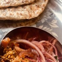 Lunch menu - Jeera Rice and flatbread with Seasonal Vegetable Sabji and Dhal dishes.  at SuRano Plant Based Indian bistro in Beeston