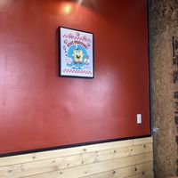 Cute Interior with Booth Seating and Stools Facing Window - It’s Cozy (Small).  at Nice Burger in Long Beach