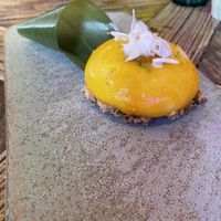 Delicious toasted coconut and mango/passion fruit dessert   at Desoriente - Poblenou in Barcelona