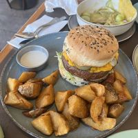 Burger and crispy potatoes  at Puerta in Buenos Aires