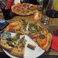 A mix of the carbonara, pepperoni, chicken and salami pizza  at Vegan Pizza Bar in The Hague