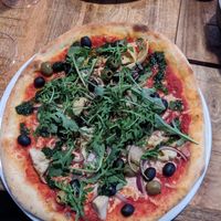 Arti joking me pizza at Vegan Pizza Bar in The Hague