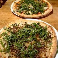 Sausage pizza and artichoke pizza at Vegan Pizza Bar in The Hague