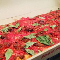 Roasted tomatoes, beyond meat sausage crumbles, carmelized onions and basil at Jules Thin Crust Pizza in Jenkintown