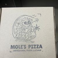Their take away box  at Mole's Pizza in Puerto Vallarta