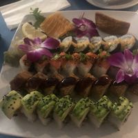 From top left: salmon sashimi, inari nigiri, Maui roll, Seattle roll, dragon roll, and goddess roll  at The Sushi Samurai - Queen Anne in Seattle
