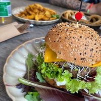 Portabello burger, onion rings, potato wedges. at Copper Branch in Rotterdam