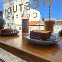 Banana bread, Orange cake and iced latte 🩷 at thestudio.coffee in Praia Da Luz