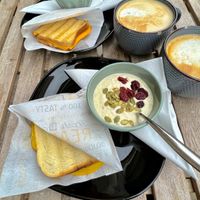 Yoghurt, over night oats, pepperoni sandwich, peanut butter & smoked cheese sandwich, oat lattes. All vegan!   at Encanto - Art Cafe in Helsinki