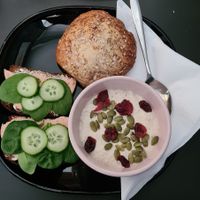 Overnight oats, cinnamon bun and rye bread at Encanto - Art Cafe in Helsinki