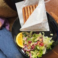 Ham and cheese panini with side salad at Encanto - Art Cafe in Helsinki