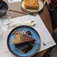 Vegan Ferrero Rocher tart, €7 (orange cake is NOT vegan) at Sailing Club Sea Lounge in Crete