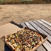 Lots of open space with tables and benches to sit outside and enjoy the food.  at OSM Eats in Langley