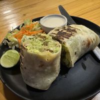 Falafel tortilla with thini (sesame paste) on side .  at Vegan Meals in Chiang Mai