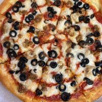 Pizza with plant-based cheese and plant-based sausage  at Athena's in Cuyahoga Falls
