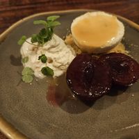 Dessert with pistachio/macadamia parfait, espuma, plum at Gärtnerei  in Essen