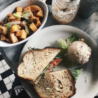 Israelite sandwich w side of potato salad & Sweet chili roasted potatoes. at The Witches Brew in West Hempstead