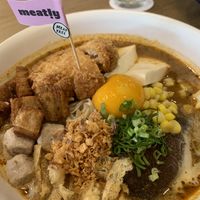 Tom yum noodle with vegan egg yolk    at CANES Vegan Casual Dining Restaurant & Grocery Store in Bangkok