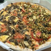 Half "vegan wild mushrooms" and half "vegan pesto" at Francesca Pizzaria - Vila Planalto in Brasilia