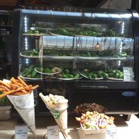 Sweet potato fries, fried vegetables, loaded fries and plenty of plates of Padrón peppers. at Padrón in Amsterdam
