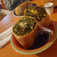 My sister trying a wrap for the firsr time! at Tassili's Raw Reality in Atlanta