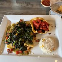Spinach enchiladas stuffed with potato, rice, black beans. veggie burrito in the background  at Casa Mezcal in Bath