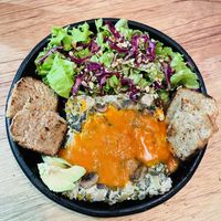 Quiche with toasted bread and salad  at Bici Cafe in San Agustin