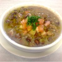 “FOUL” our Fava Beans Dip. With Extra Virgin Olive Oil, Garlic, Lemon and Topped with Diced Tomato / Parsley.  at Alforon in San Diego