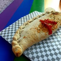 Vegan calzone filled with non-dairy cheese ! Amazing ! at PIZZABELLA in Santiago