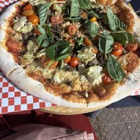 Soy meat, cherry tomatoes, artichoke and basil pizza   at PIZZABELLA in Santiago