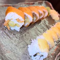 cowgirl (tastes like a cheeseburger 🤯) on the left, and crunchy cabbage (ordered “extra crunchy”)  on the right 😋   at Blue Sushi Sake Grill in Houston