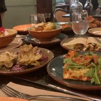 Artichoke Flowers (in front on the left), Mini Pizza (in front on the right), Patatas bravas (in the back in the middle), Guacamole Taco (in the back on the right) but we had more  at Velada in Barcelona