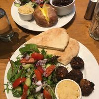 Jacket potato + falafel, hummus and pitta at World Peace Cafe in Derby