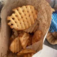 Very generous portion of waffle fries!  at Soy Boys in Toronto