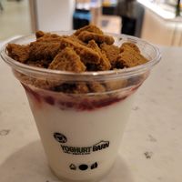 Frozen yogurt with crushed cookies and strawberry sauce. So good! at YB (Yoghurt Barn) by Autogrill Belgium in Brussels