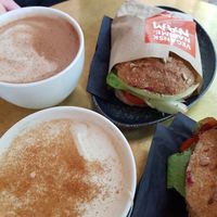 Hot chocolate, chai latte, beet-hummus sandwich with sundried tomatoes and paprika at Papegoye in Oslo