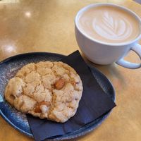 Lemon cookie with almonds and oat latte at Papegoye in Oslo