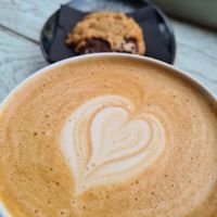 Oat latte and peanut cookie at Papegoye in Oslo