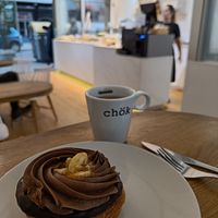 Cronut with chocolate topping and Americano at Chök - Valencia in Valencia