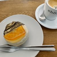 Cronut with orange topping and Americano at Chök - Valencia in Valencia