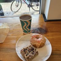 Pumpkin glazed fried doughnut, mixed nut and coconut bar and a cup of filter coffee  at All Roads in Jefferson