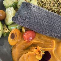 Blue corn & bean tamale with roasted veggies and rice  at Wahpepah's Kitchen in Oakland