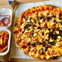 Vegan chicken and chilli pizza with sweet potato fries  at Pizza Piccolo in South West London
