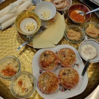A brunch platter with baked oats, hummus, egg salad and butter (as spreads for the homemade bread also served) at Café Hyggestund' in Birkeroed