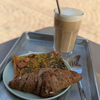 Croissant and vegetable flan, white macadamia coffee. at Origin - Coffee Shop Végétal in Strasbourg
