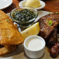 Chips, fish, spinach, steak, sausage, wing (and fufu in the background) + lemon and mayonnaise at Romeo and Vero Vegan Butcherie and Restaurant  in Cape Town