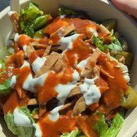 Build your own grain bowl with harissa sauce and garlic sauce   at CAVA in Ramsey