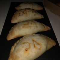 Empanadas de cebolla con mozzarella vegana  at El Cafè De La Mirta in Barcelona