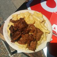 Bowl of BarBQ beef, mac & cheese, greens on the bottom at Southern Fried Vegan BBQ in Los Angeles