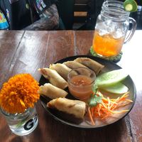 Paw pia rolls and lemongrass ice tea at Natnat Thai Comfort Food in Amed